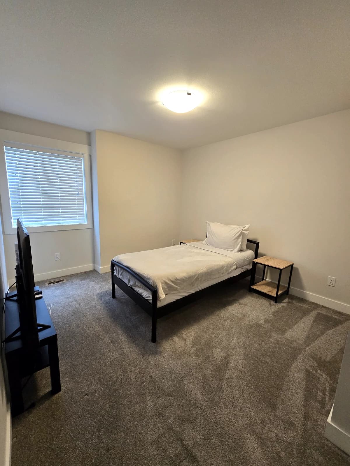 Furnished bedroom at the Maitland townhouse