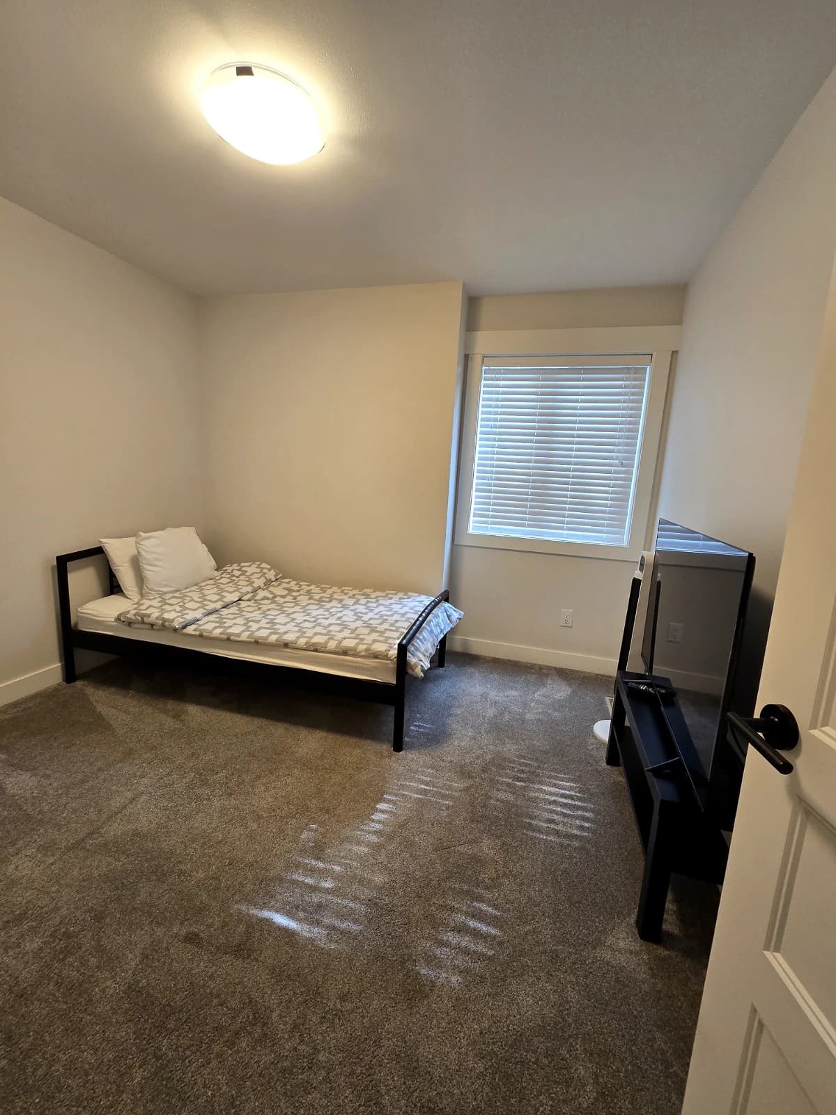 Furnished bedroom at the Maitland townhouse